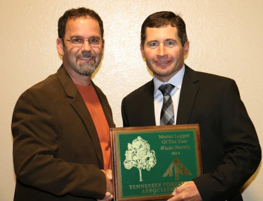 Wade Norris receiving the 2014 Master Logger of the Year plaque from the Tennessee Forestry Association